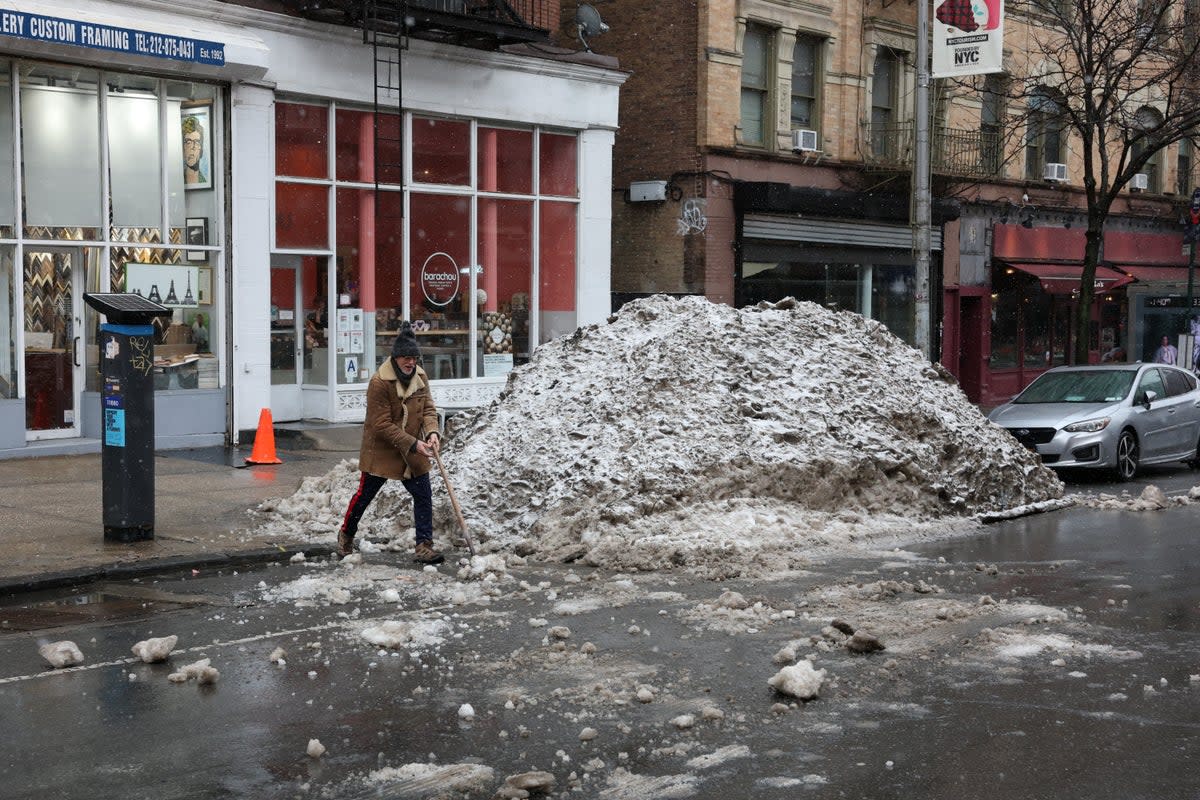 A blizzard warning went into effect as New Yorkers continued to contend with snowfall from a January storm that is believed to have killed an estimated 26 people (AFP via Getty)