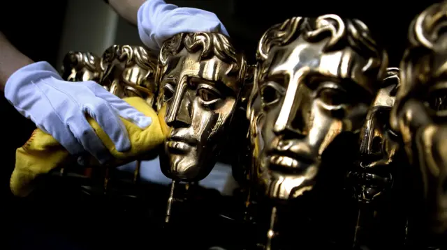Bafta statuettes being polished