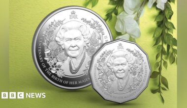 A commemorative silver coin featuring a portrait of Queen Elizabeth II