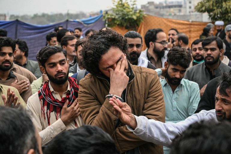 EDITORS NOTE: Graphic content / Shiite Muslims mourn outside a mosque following an explosion, in Islamabad on February 6, 2026.
