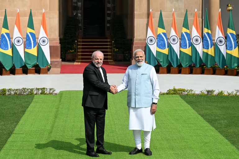 India's Prime Minister Narendra Modi (R) shakes hands with Brazil's President Luiz Inacio Lula da Silva before their meeting at the Hyderabad House in New Delhi on February 21, 2026. (Photo by Sajjad HUSSAIN / AFP)
