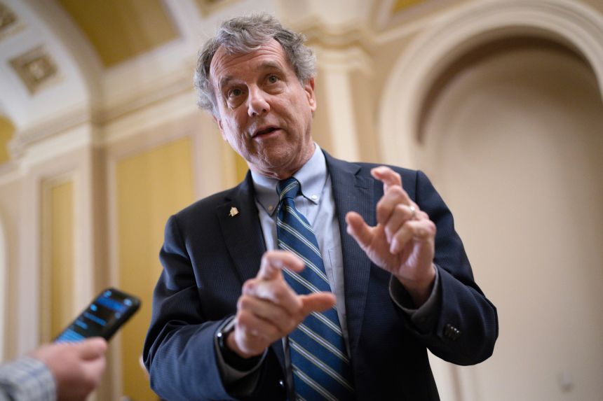 Then-Sen. Sherrod Brown of Ohio speaks with reporters at the Capitol in Washington, March 15, 2023.