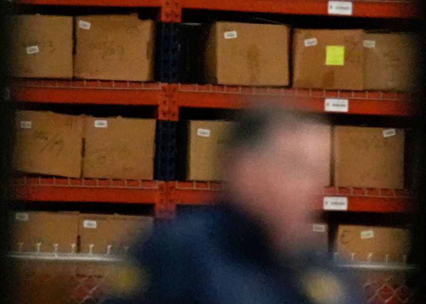 An FBI employee stands inside the Fulton County elections center in Georgia on January 28, as the FBI seizes 2020 election ballots.