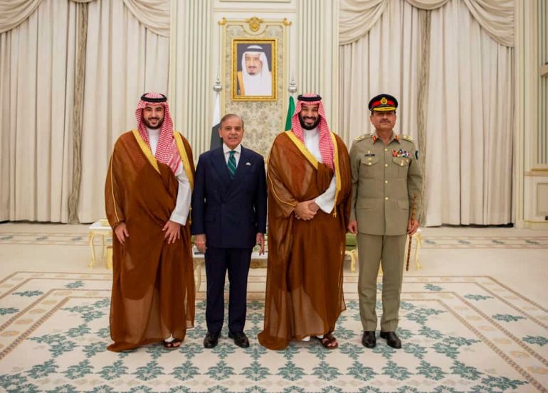 In this photo released by Pakistan's Press Information Department, Saudi Arabia's Crown Prince Mohammed bin Salman, second right, Saudi Arabia's Defence Minister Khalid bin Salman, left, Pakistan's Prime Minister Shehbaz Sharif, second left, and Pakistan's Army Chief Field Marshal Asim Munir, pose for photographs after signing a mutual defense pact, in Riyadh, Saudi Arabia, Wednesday, Sept. 17, 2025. (Press Information Department via AP)