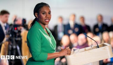 Rachel Reeves is seen in closeup in a red top.