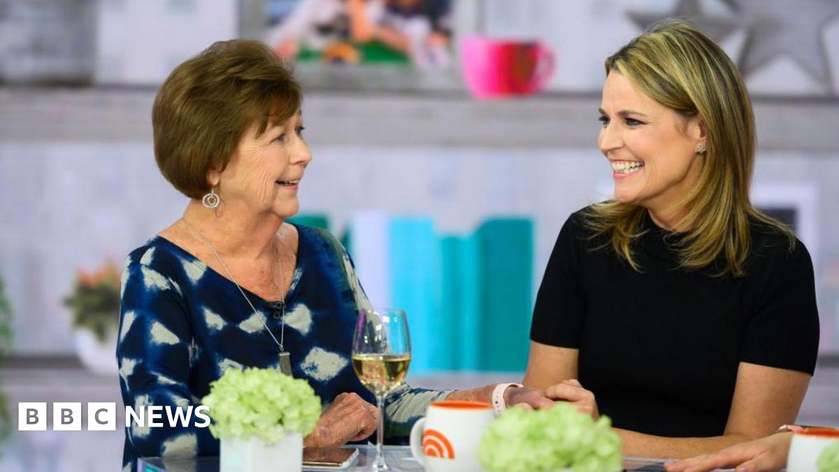 Savannah Guthrie (right) and her mother Nancy Guthrie (left) sit together at a table on the set of the TODAY Show.