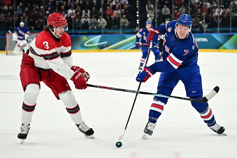 USA's #07 Brady Tkachuk passes the puck during the men's preliminary round Group C Ice Hockey match between USA and Denmark at the Milano Santagiulia Ice Hockey Arena during the Milano Cortina 2026 Winter Olympic Games in Milan, on February 14, 2026. (Photo by JULIEN DE ROSA / AFP via Getty Images)