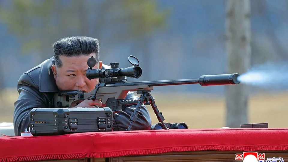 North Korea's official KCNA news agency shows North Korean leader Kim Jong Un firing a new sniper rifle, at an undisclosed place in North Korea. - KCNA VIA KNS/AFP/Getty Image