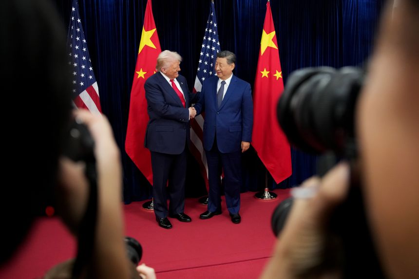 US President Donald Trump greets Chinese President Xi Jinping ahead of a bilateral meeting at Gimhae Air Base on October 30, 2025 in Busan, South Korea.