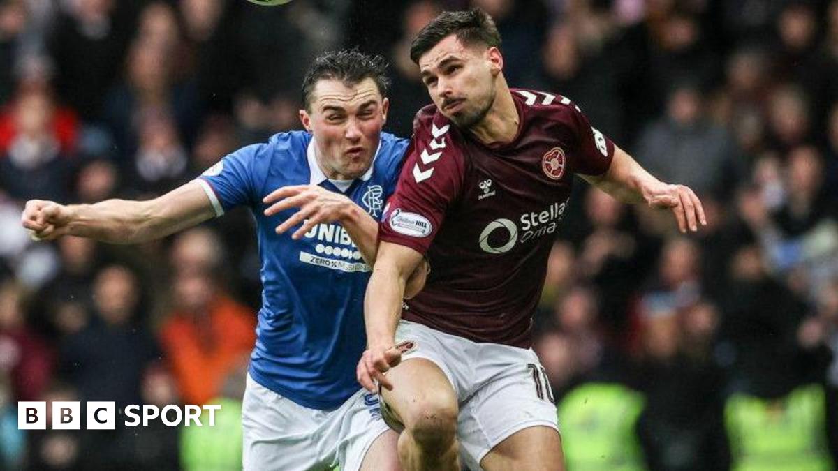 Hearts' Claudio Braga (R) and Rangers' John Souttar in action during a William Hill Premiership match between Rangers and Heart of Midlothian at Ibrox Stadium