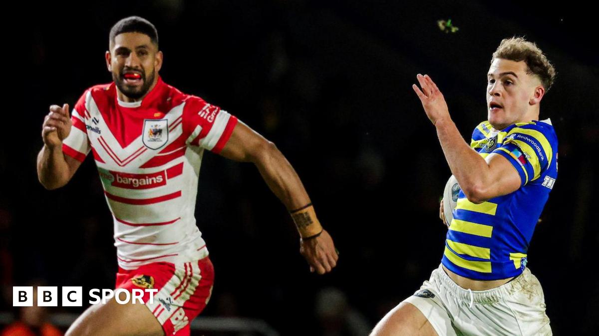 Cai Taylor-Wray (right) races in for his try for Warrington against St Helens