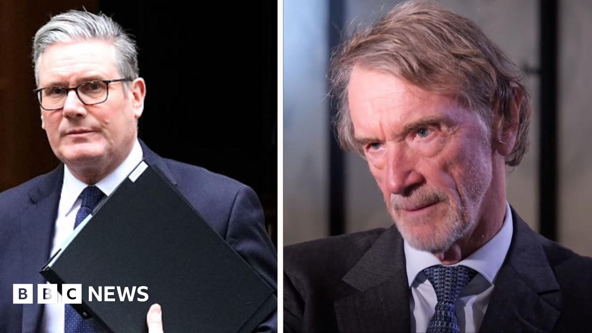 Sir Jim Ratcliffe, who has brown greying hair and a grey stubble beard, wears a beige linen suit jacket with a white shirt and red tie