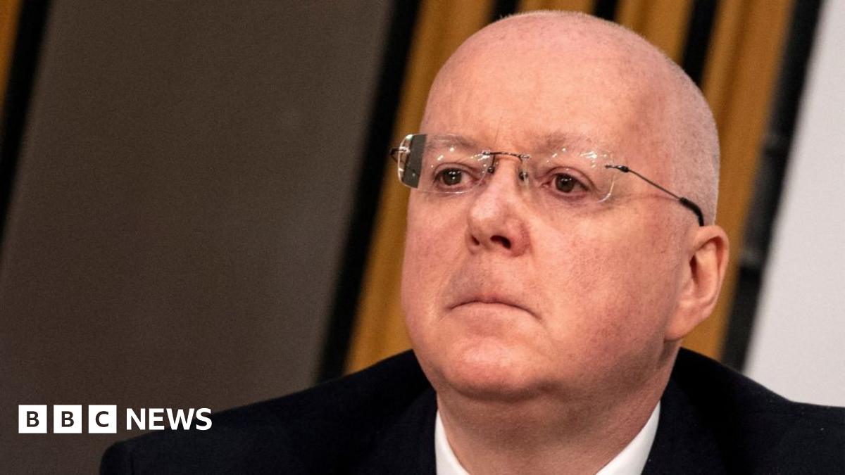 Peter Murrell, who is bald with glasses, in a close-up shot. He is wearing a dark suit, white shirt.