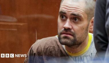 Director Rob Reiner and his son Nick Reiner are seated on a stage while holding microphones during a panel discussion.