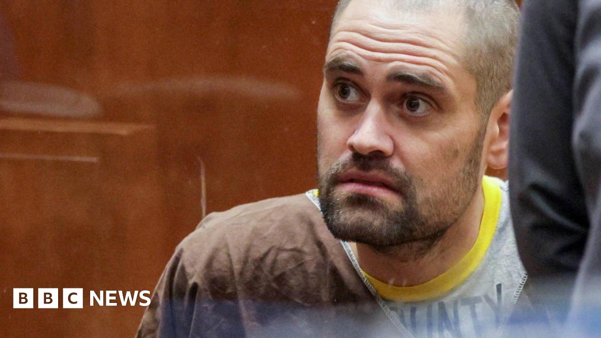 Director Rob Reiner and his son Nick Reiner are seated on a stage while holding microphones during a panel discussion.
