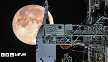The Moon sets behind NASA's Artemis II SLS (Space Launch System) rocket and Orion spacecraft atop a mobile launcher at Launch Complex 39B at NASA's Kennedy Space Center in Florida on Sunday, February 1, 2026.