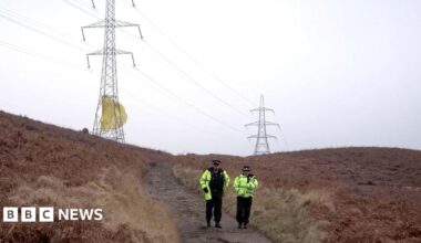 A red tube on a blue background - part of the parachute system which contains propellant.