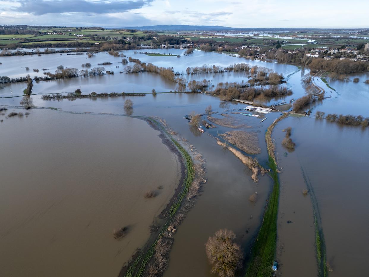 LANGPORT, UNITED KINGDOM - JANUARY 28: Flood water surrounds Langport on the Somerset Levels following heavy rain on January 28, 2026 in Somerset, England. Storm Chandra brought strong winds and heavy rain across much of the country which lashed large parts of the country, hitting travel and cutting power. While across the UK numerous flood warnings were still in place after weeks of heavy rainfall, the UK's Environment Agency has warned people to expect flooding to become more frequent because of climate change. (Photo by Anna Barclay/Getty Images)