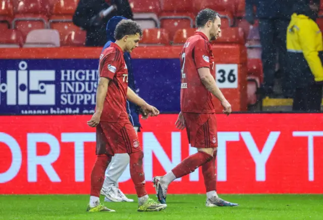 Aberdeen's Dennis Geiger (L) and Nicky Devlin look dejected at full time