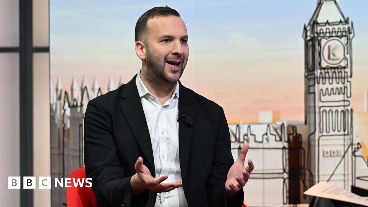 Thin, red banner promoting the Politics Essential newsletter with text saying, “Top political analysis in your inbox every day”. There is also an image of the Houses of Parliament.