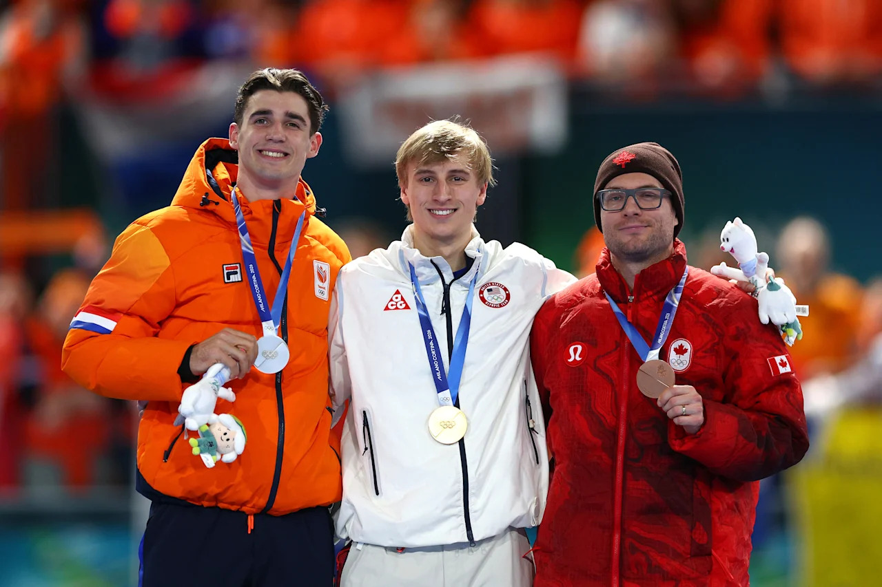 MILAN, ITALY - FEBRUARY 14: Gold medalist Jordan Stolz of Team United States, Silver medalist Jenning de Boo of Team Netherlands and Bronze medalist Laurent Dubreuil of Team Canada pose for a photo on the podium during the medal ceremony for the Speed Skating Men's 500m on day eight of the Milano Cortina 2026 Winter Olympic games at Milano Speed Skating Stadium on February 14, 2026 in Milan, Italy. (Photo by Dean Mouhtaropoulos/Getty Images)