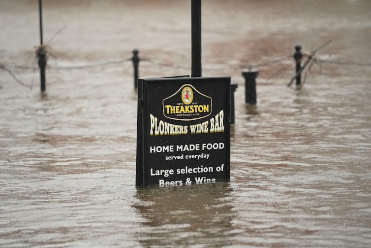 Plonkers wine bar sign in floodwaters