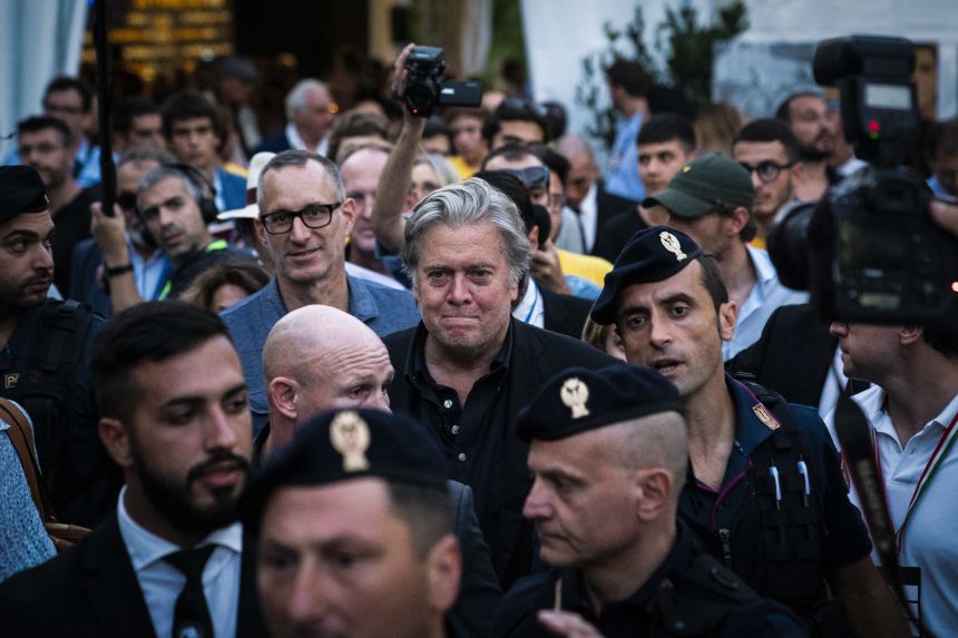 Former White House Chief Strategist Steve Bannon makes his way through crowds surrounded by his entourage after speaking at Atreju 2018.