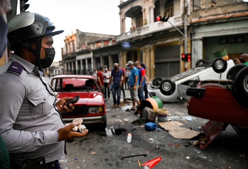 A policeman watches over the aftermath of a rare demonstration against Cuban President Miguel Diaz-Canel in Havana, on July 11, 2021.