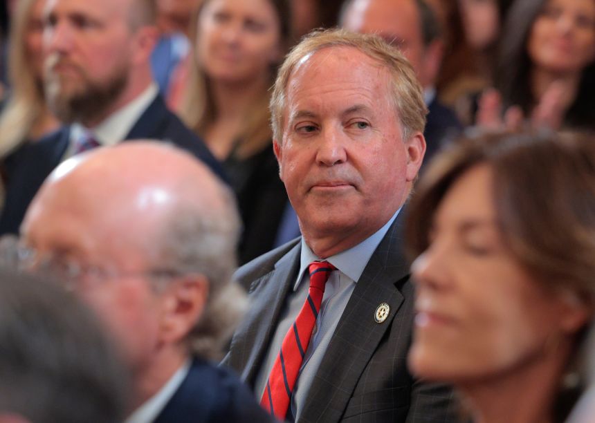 Texas Attorney General Ken Paxton attends the executive order signing ceremony to reduce the size and scope of the Education Department in the East Room of the White House on March 20, 2025 in Washington, DC.