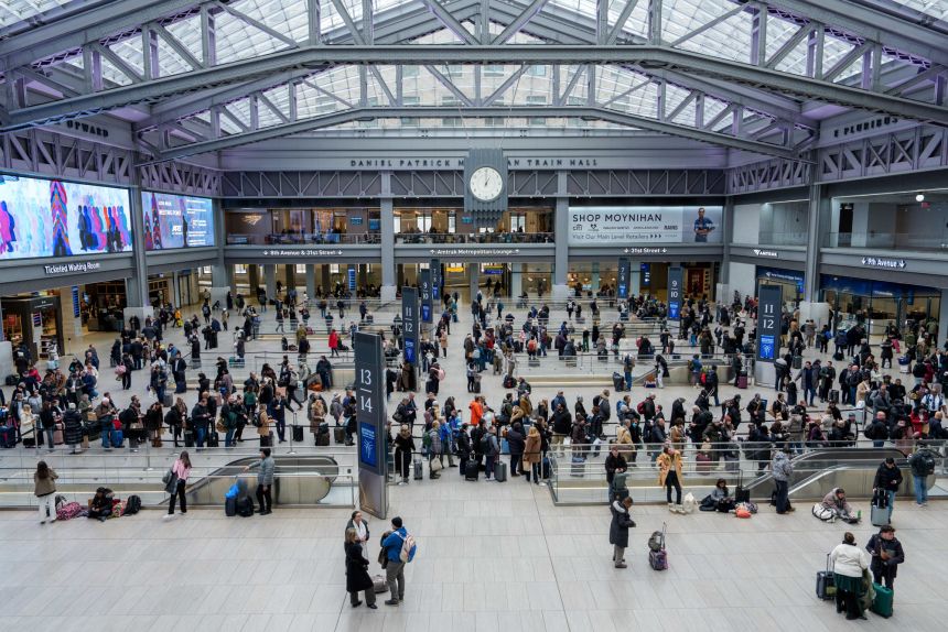 Travelers in Moynihan Train Hall at Penn Station in New York on January 23.