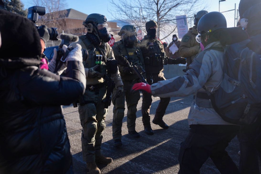 Sheriff deputies push back protesters that had filtered onto the street in front of the Bishop Henry Whipple Federal Building in Minneapolis on January 30, 2026.