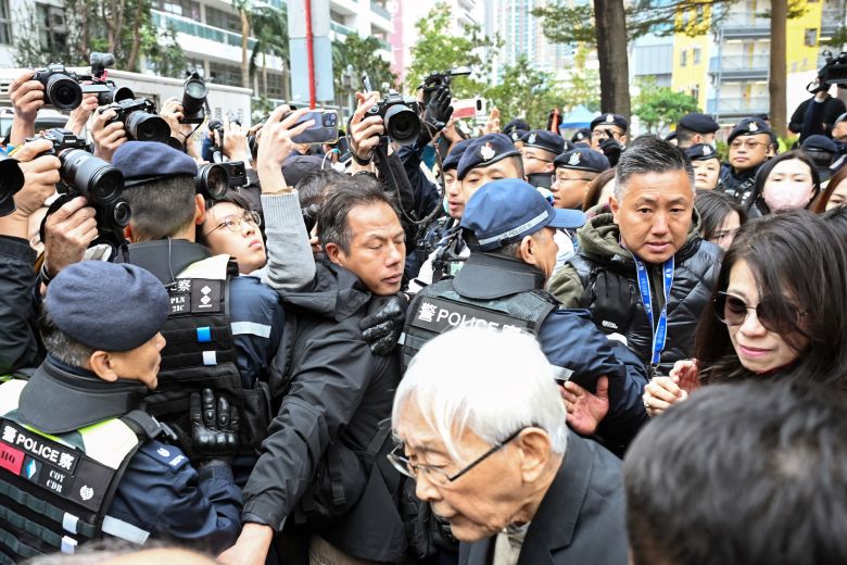 Teresa Lai, wife of Jimmy Lai, and Joseph Zen, retired cardinal of the Catholic Church, leave the West Kowloon Magistrates Court following Lai's sentencing in Hong Kong, on February 9, 2026.