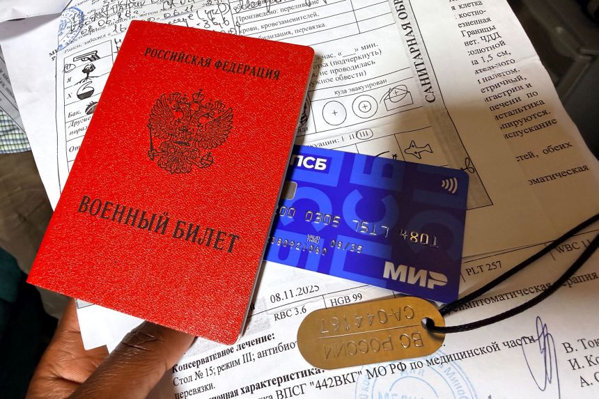 Patrick Kwoba showed CNN his Russian army paperwork.