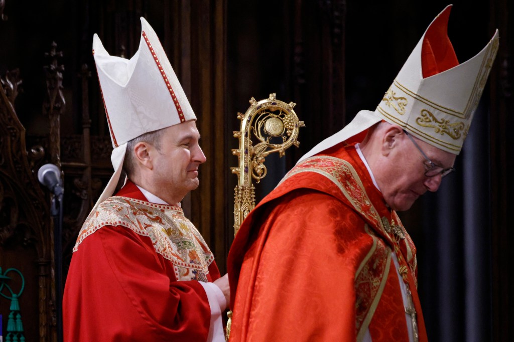 Ronald Hicks (left) and Cardinal Timothy Dolan (right) at the installation of Archbishop Hicks.
