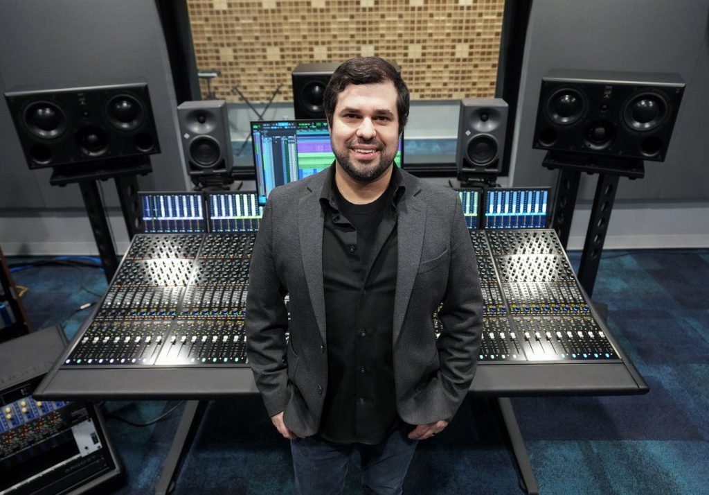 Justin Gray poses for a photograph in his digital music studio at Humber College in Toronto