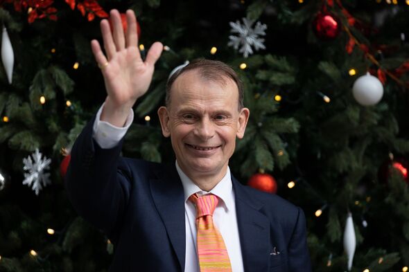 Andrew Marr gestures to the media at BBC Broadcasting House...