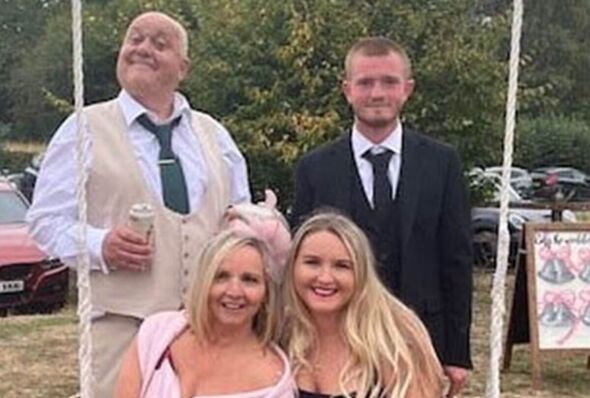 Mark Ashley pictured back row left with family