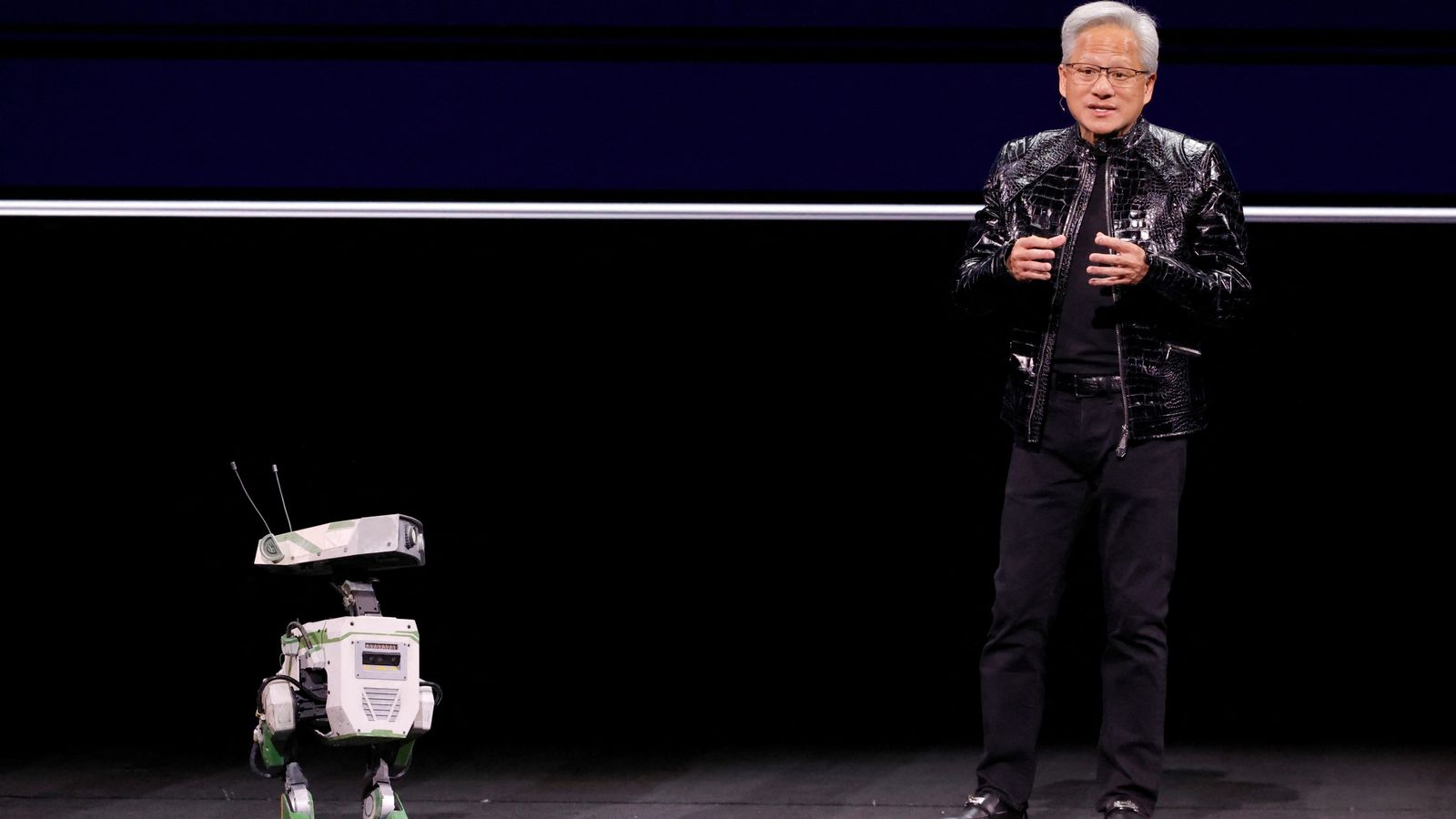 Nvidia chief executive Jensen Huang is joined onstage by a robot at the annual consumer electronics trade show. Pic: Reuters
