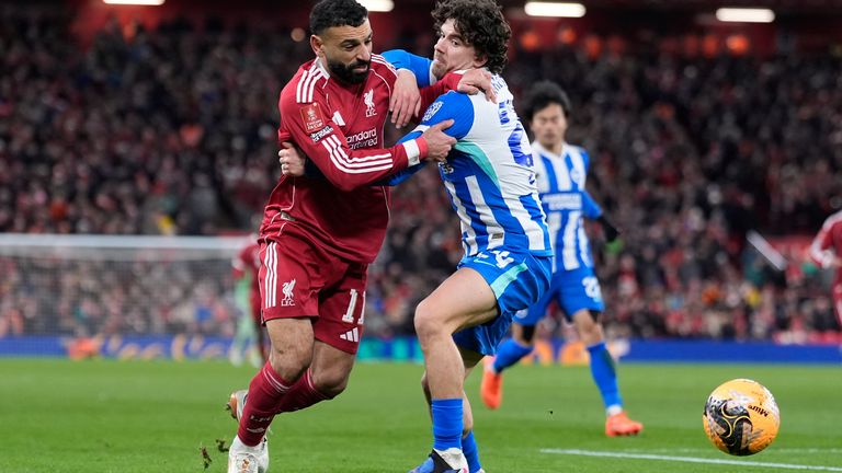 Liverpool's Mohamed Salah and Brighton and Hove Albion's Ferdi Kadioglu battle for the ball during the Emirates FA Cup fourth round match at Anfield, Liverpool. Picture date: Saturday February 14, 2026. PA Photo. Photo credit should read: Peter Byrne/PA Wire...RESTRICTIONS: EDITORIAL USE ONLY No use with unauthorised audio, video, data, fixture lists, club/league logos or "live" services. Online in-match use limited to 120 images, no video emulation. No use in betting, games or single club/league/player publications.