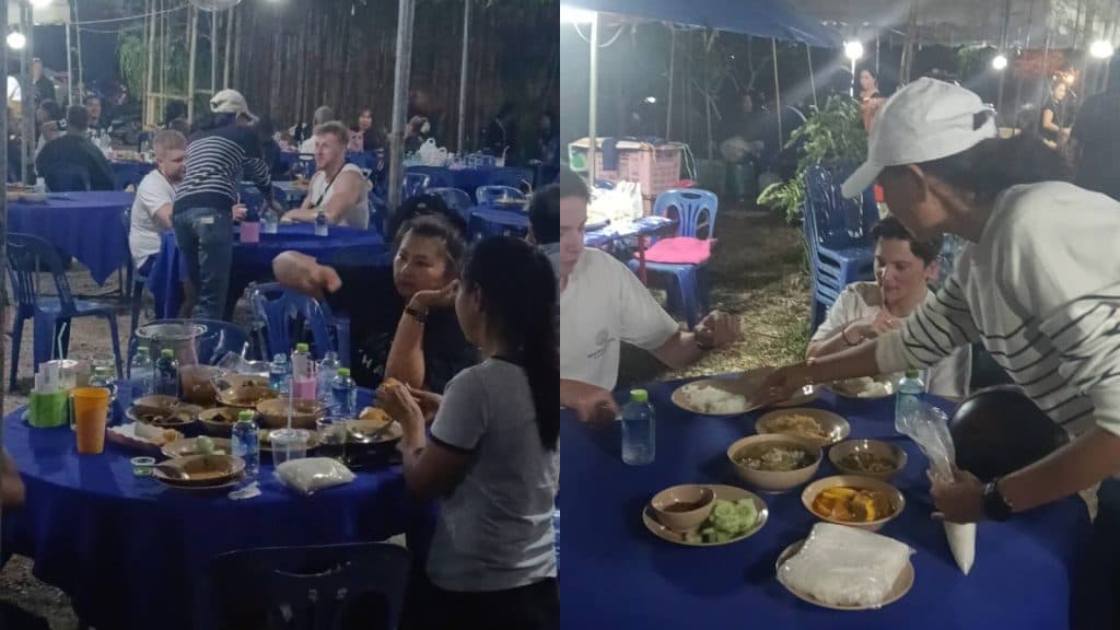 tourists eating at thai funeral
