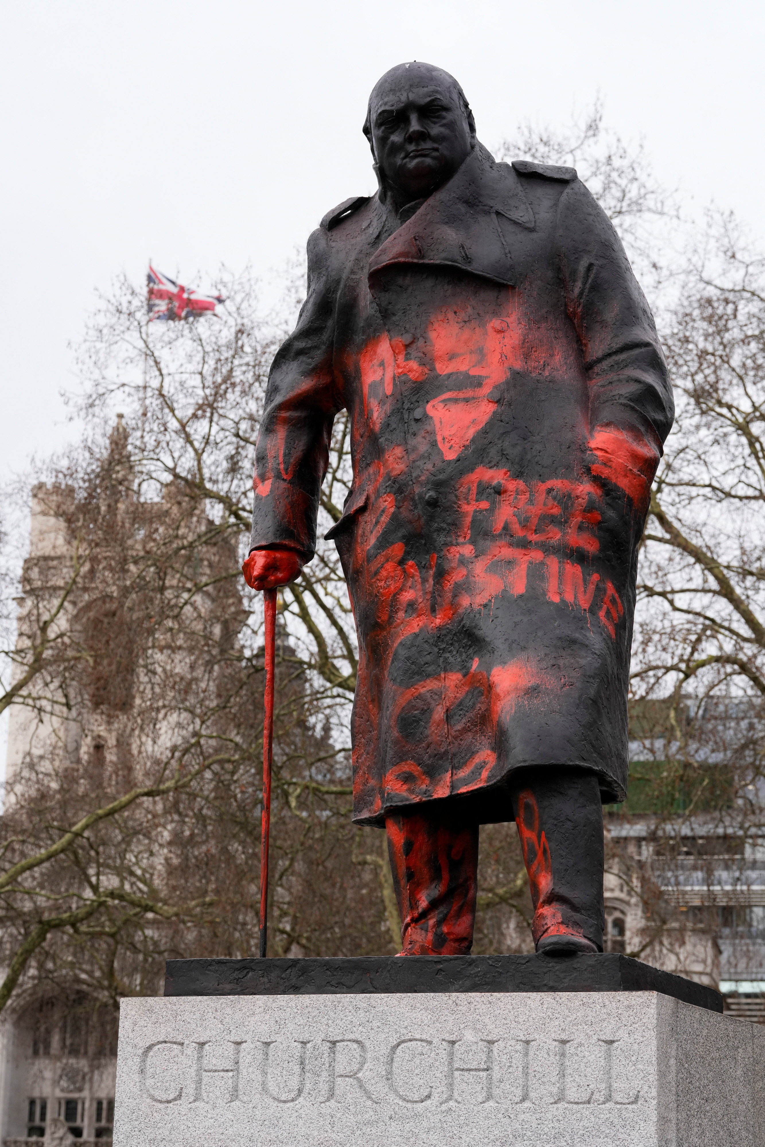 The Winston Churchill statue in Parliament Square, London, defaced with red paint and the words "Free Palestine".