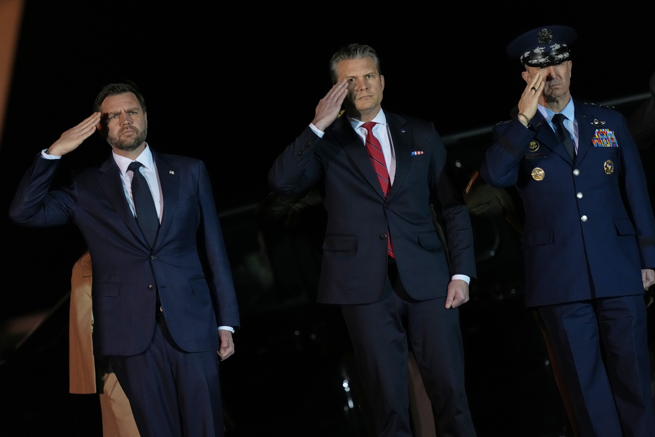 JD Vance, Pete Hegseth, the war secretary, and General Dan Caine, chairman of the joint chiefs of staff, at Dover Air Force Base