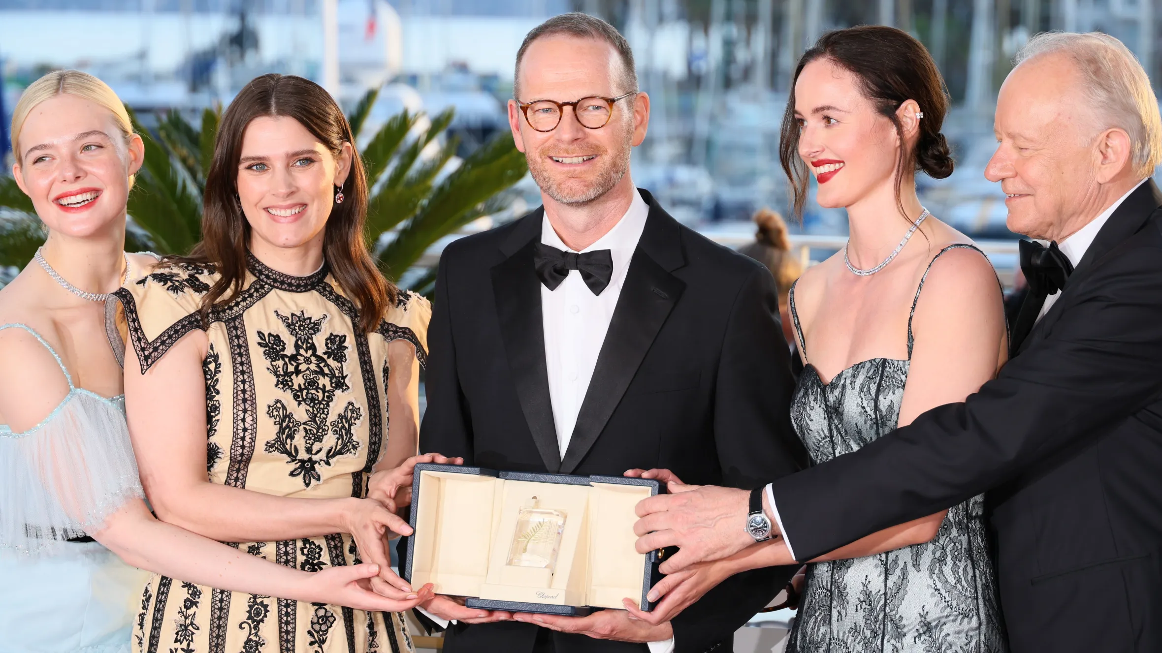 Joachim Trier holds the grand prix award for Sentimental Value at the Cannes festival last year with, from left, Elle Fanning, Inga Ibsdotter Lilleaas, Renate Reinsve and Stellan Skarsgard