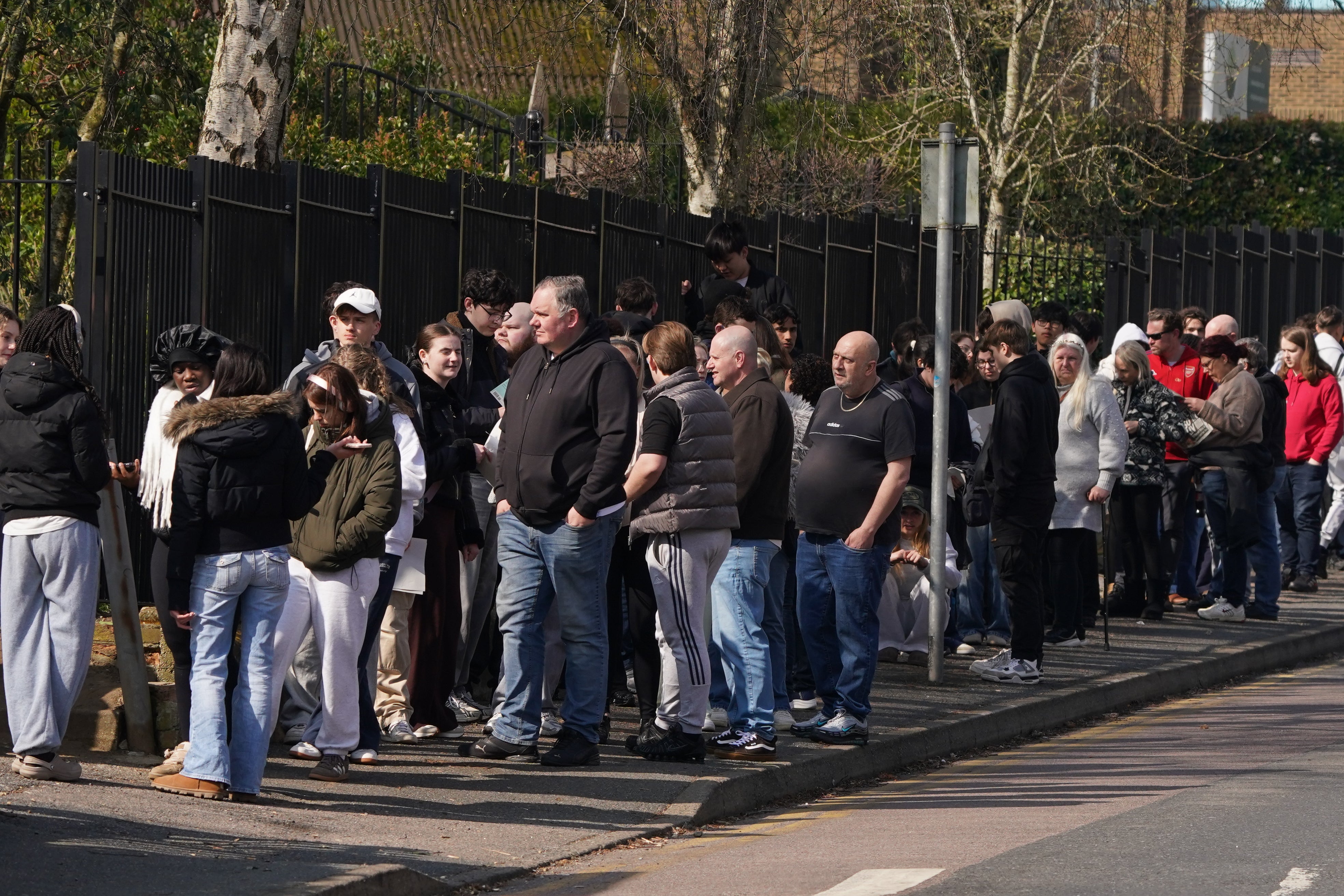 People queuing to receive vaccines and antibiotics at Vicarage Lane Clinic, Ashford, on Sunday