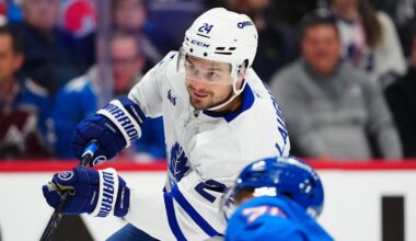 Jan 12, 2026; Denver, Colorado, USA; Toronto Maple Leafs center Scott Laughton (24) takes a shot on goal in the first period at Ball Arena. Mandatory Credit: Ron Chenoy-Imagn Images