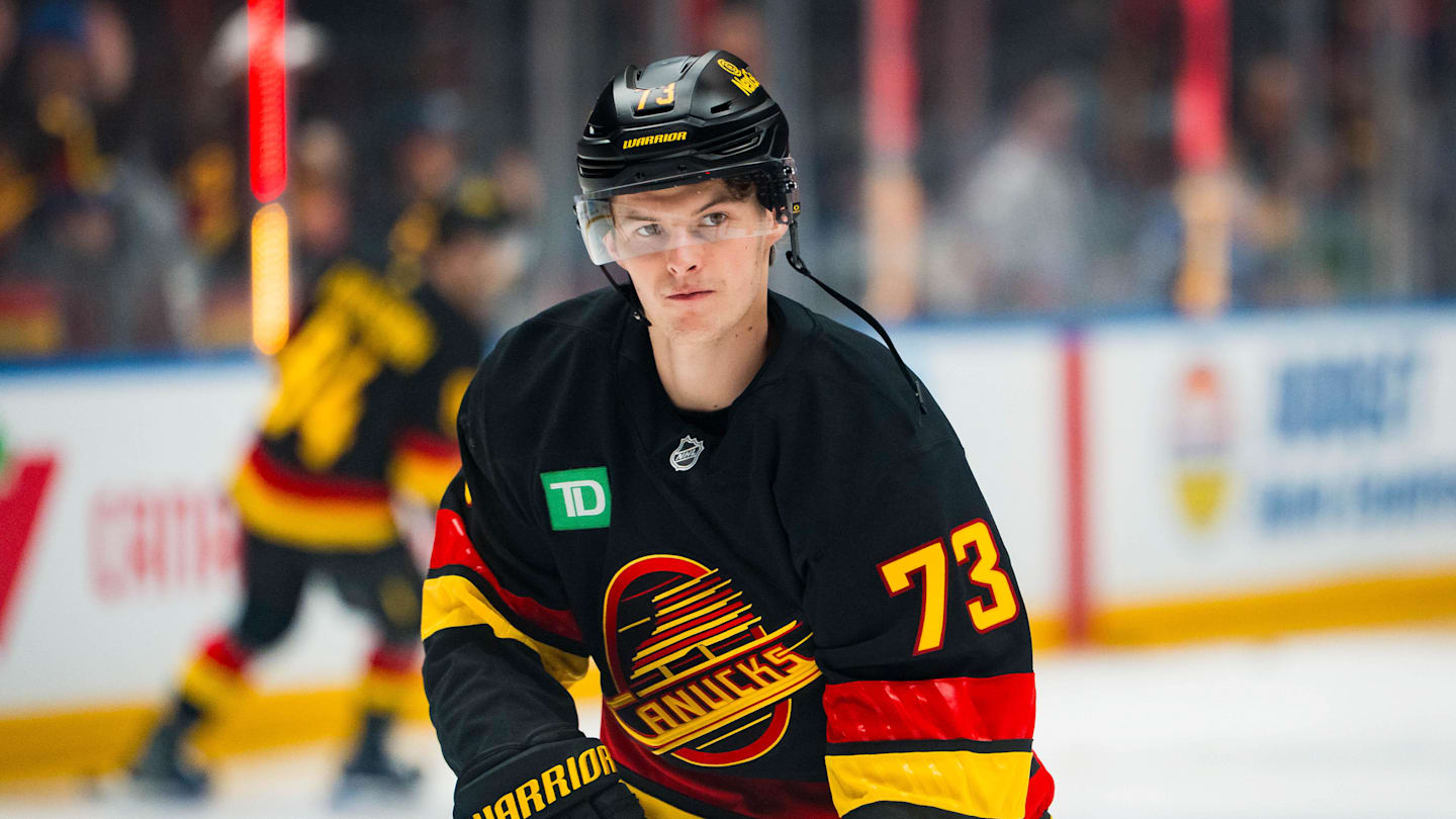 Oct 28, 2025; Vancouver, British Columbia, CAN; Vancouver Canucks forward Lukas Reichel (73) shoots  during warm up prior to a game against the New York Rangers at Rogers Arena. Mandatory Credit: Bob Frid-Imagn Images