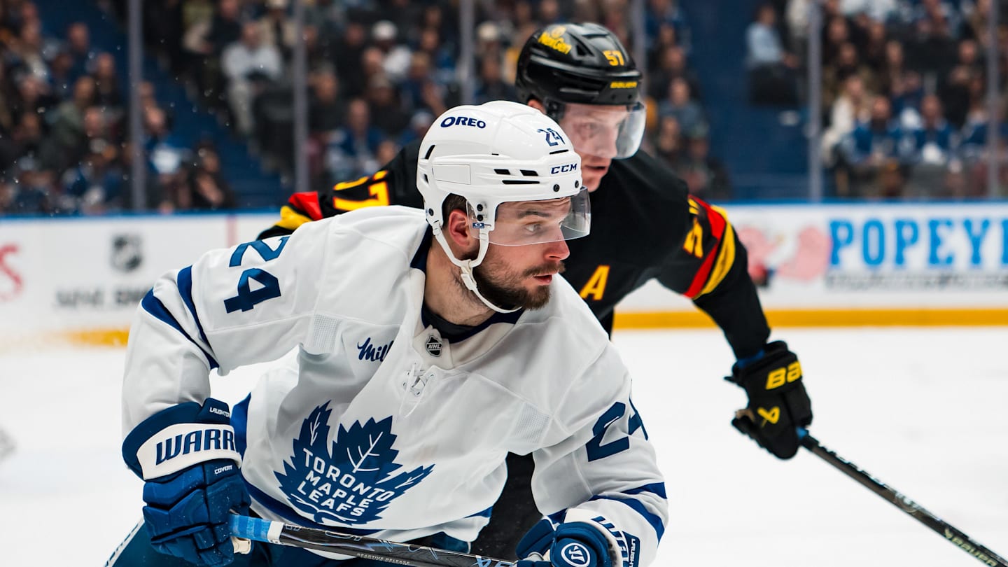 Jan 31, 2026; Vancouver, British Columbia, CAN; Vancouver Canucks defenseman Tyler Myers (57) defends against Toronto Maple Leafs forward Scott Laughton (24) in the third period at Rogers Arena. Mandatory Credit: Bob Frid-Imagn Images