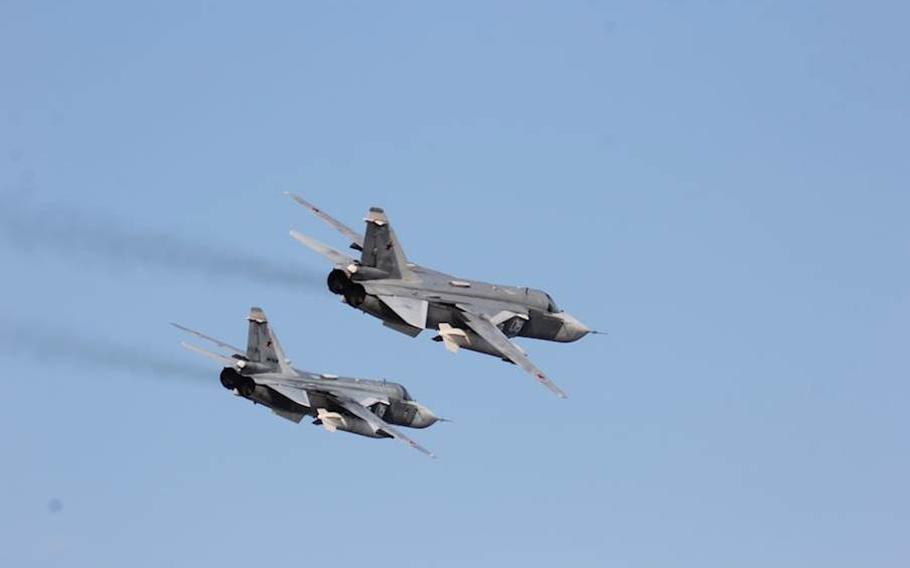 Two aircraft fly side by side.