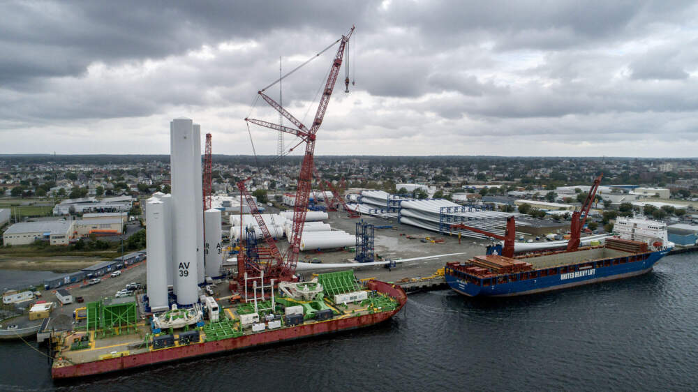 Wind turbine components are organized on the dock at New Bedford Marine Commerce Terminal to be shipped to their destinations. (Robin Lubbock/WBUR)