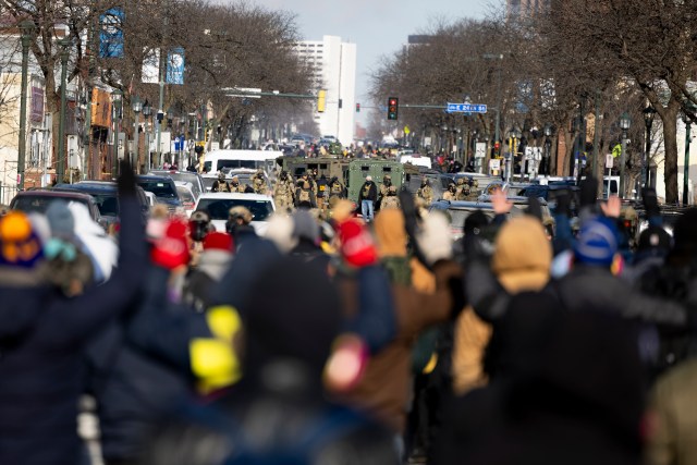 Protesters advance toward federal agents with their hands up at the scene where an observer of immigration enforcement operations was shot and killed by a federal agent near the intersection of 26th Street and Nicollet Avenue on Saturday, Jan. 24, 2026, in Minneapolis, Minn.